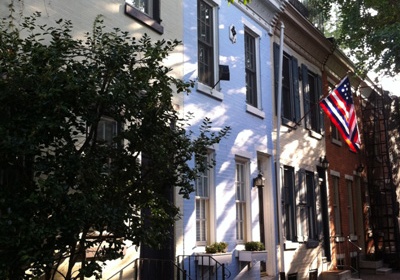 Beautiful blue row house on a small street in Philadelphia.